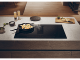 Placa inducción con extractor integrado - Haier HAIH82MTMCF, 4 Zonas Flex, 15 niveles de potencia en cocción + Booster, Negro